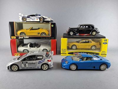 three toy cars are sitting on a table next to each other