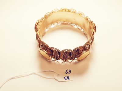 a ring with a price tag on it sitting on a table