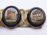 a picture of a bracelet with a picture of a building