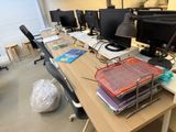 a desk with a bunch of computer monitors on it