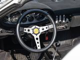 dashboard of a car with a steering wheel and dashboard controls
