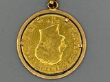 l'image d'une pièce d'or sur laquelle figure le visage d'une femme
