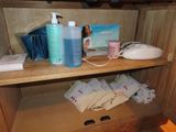 a wooden shelf with a lot of items on top of it