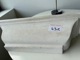 a white planter with a sticker on it sitting on a table