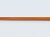 a pencil that is sitting on a white surface