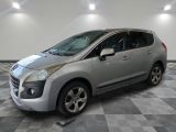 a picture of a silver car parked in a garage