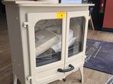 a small stove that is on display in a room