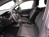 the interior of a car with a steering wheel and a dashboard