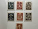 the netherlands stamps are on display in a glass case