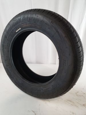 a close up of a tire on a white surface with a white background