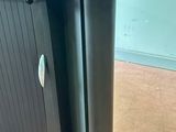 a black desk with a black top and a black base