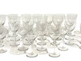 a lot of empty wine glasses sitting on a table