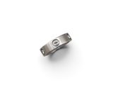 a close up of a ring on a white surface