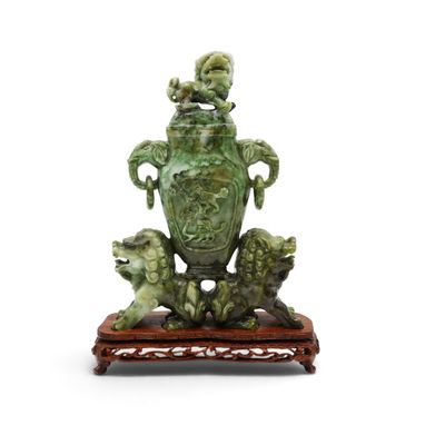 an image of a green vase sitting on top of a wooden stand
