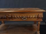 an old wooden table with a drawer on top of it