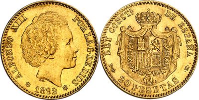 a close up of a gold coin with a crown on it