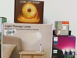 a table with a lamp on top of it next to other items