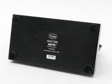 an image of a close up of a black electronic device on a white surface
