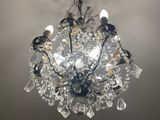a chandelier hanging from the ceiling in a room
