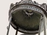 a large metal bell that is on top of a stand