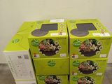 three boxes of food are stacked on a pallet in a warehouse