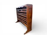 an image of a wooden shoe rack with several pairs of shoes on it