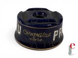 a black and gold cup on a white surface