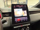 the dashboard of a car with a tablet on the dashboard