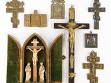 many religious items displayed on a white surface
