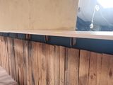 a bar made out of pallet wood with a bar top