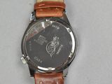 wrist watch with brown leather strap and black face