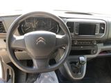 dashboard view of a car with a steering wheel and dashboard controls