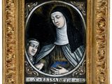 un tableau représentant une femme tenant un enfant dans un cadre en or