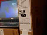 a box with a sticker on it sitting next to a laptop