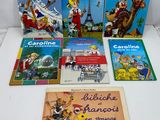 a group of children ' s books sitting on top of a table