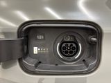 a close up of a car ' s fuel tank with a plugged in