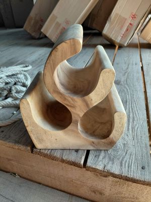 a wooden object that is sitting on a wooden floor