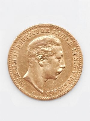 une vieille pièce d'or sur laquelle figure le portrait d'un homme