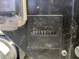 a close up of a meter on the side of a building