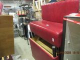 a red chair that is sitting in a room