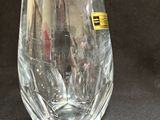 a wine glass that is sitting on a table