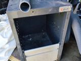 an image of a metal box with pipes and hoses in it