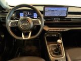 the interior of a car with a steering wheel, dashboard, and dash board