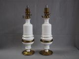 pair of white and gold lamps on a grey background