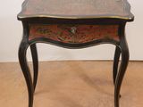 an image of a small table with a drawer underneath it