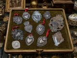 a box with a bunch of silver ornaments on it