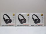 two boxes of wireless headphones are sitting on a table