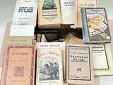 a lot of books that are sitting on top of a table