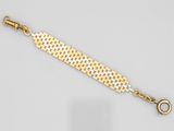 un bracelet en or et en argent muni d'un fermoir