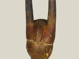 statue of a hand holding a peace sign made out of wood